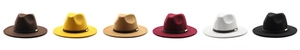Row of wool jazz fedora hats in various colors with buckle bands and wide brims