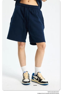 Detail of navy blue acid wash cotton shorts with drawstring and premium texture
