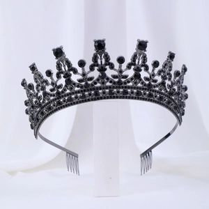 Detailed view of black rhinestone crown with built-in hair combs on white display stand
