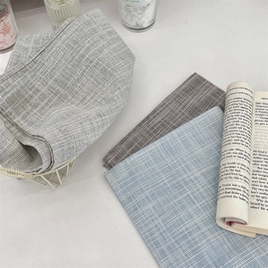 Linen textured placemats in grey, blue, and striped patterns for table decoration
