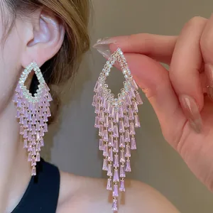 Sparkling long tassel earrings featuring purple stones and zircon fringe detail