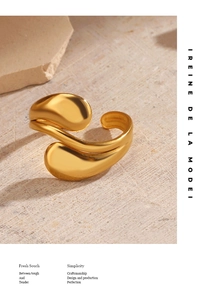 Detail of 18K gold plated teardrop open ring with smooth polished finish on stone base