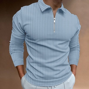 Detail of blue striped polo shirt showing vertical texture and silver half-zip collar