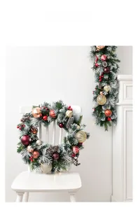 Detail of 135cm snowy Christmas garland with red berries, pine cones and warm LED lights