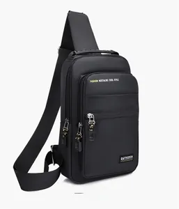 Detail view of black oxford cloth crossbody chest bag with adjustable shoulder straps