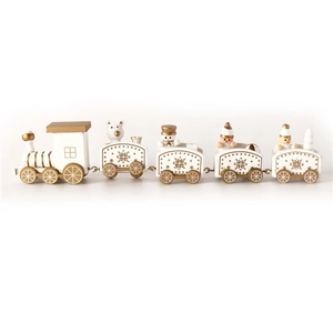 Detail view of white and gold wooden Christmas train with miniature bears and snowmen