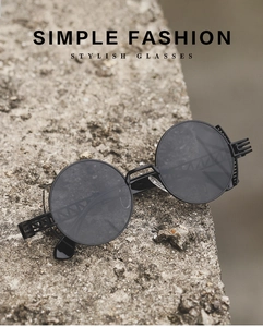 Macro shot of punk style round sunglasses featuring hollow geometric temple patterns