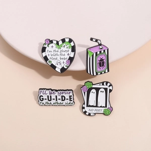 Set of four movie-inspired enamel pins featuring ghost motifs and striped designs