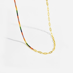 Detail of S925 sterling silver paperclip chain with rainbow gradient gemstones