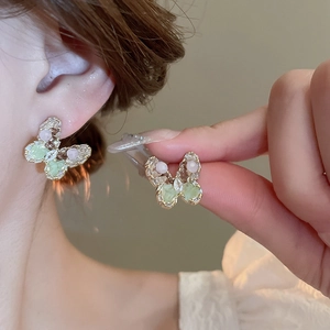 Elegant gold plated butterfly earrings with colorful crystal rhinestones on model