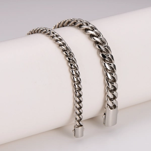 Minimalist silver stainless steel cuban link bracelet set displayed on white pillars