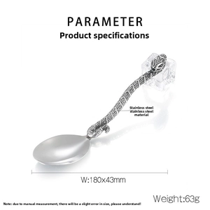Macro detail of stainless steel spoon with cobra snake handle and scale textures