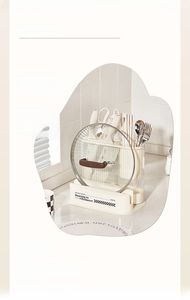 Detail of cream-colored kitchen organizer with knife slots and integrated cutting board rack