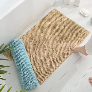 Absorbent chenille bathroom floor mats in beige and light blue with non-slip backing
