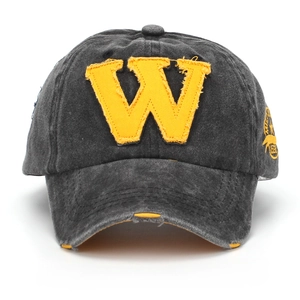 Detailed view of washed grey baseball cap with yellow W patch and distressed brim accents