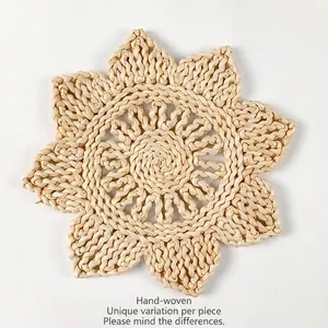 Handwoven sunflower shaped corn husk placemat with detailed heat resistant spiral texture