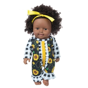 Front full-body detail of a 12-inch African baby doll with curly hair and sunflower outfit