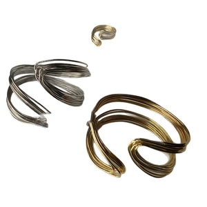 Modern twisted multi-strand metal cuff bracelets and ring in gold and silver finish