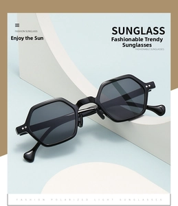 Detail of polarized hexagonal sunglasses with droplet-shaped temple tips and black frame