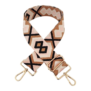Detail of colorful geometric diamond pattern woven shoulder strap with gold metal buckles