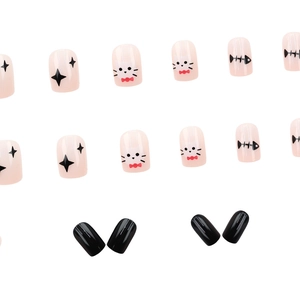 Short press-on nails with cute Halloween cat and fishbone doodles on pink base