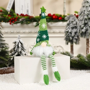 Lighted Christmas gnome doll with long legs and green striped hat on festive background