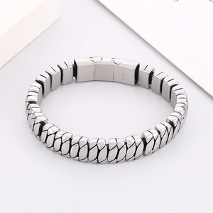 Close-up of silver stainless steel link bracelet with 316L engraved folding clasp