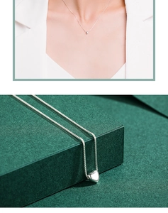 Detail view showing a silver heart pendant necklace on a model and close-up view