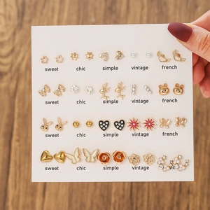 Set of 20 pairs gold stud earrings featuring enamel animals and shiny rhinestones