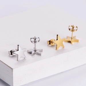 Elegant gold and silver star stud earrings with mirror polished finish and butterfly backs