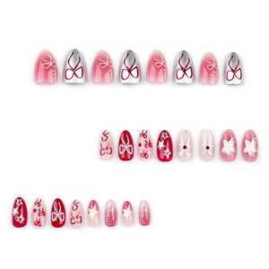 Sweet bow and star press-on nail set with red, pink gradient, and silver metallic pieces