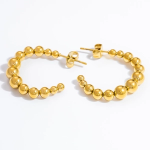 Detailed view of 18k gold plated stainless steel hoop earrings with graduated beads design