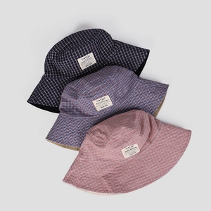 Three vintage plaid bucket hats in blue and red cotton with stylish rectangular woven labels