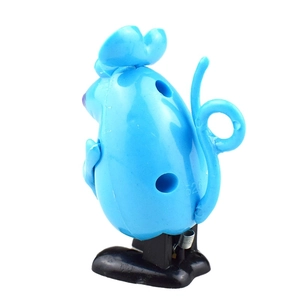 Close-up of blue wind-up clockwork mouse toy with metal spring and black base