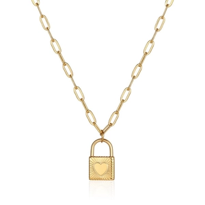 Gold heart lock pendant necklace with paperclip chain and radiant sunburst engraving
