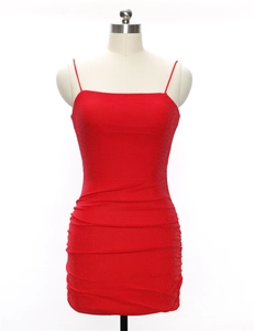 Close-up of red sequin mini dress featuring thin straps and gathered pleat details