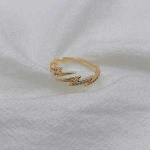 Minimalist gold lightning bolt ring featuring sparkling micro-pave cubic zirconia crystals