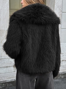 Back view of a black faux fur coat with oversized fluffy collar for winter season
