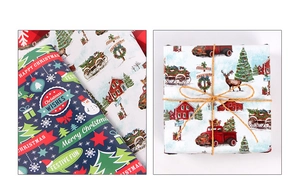 Detail of Christmas wrapping paper featuring vintage red trucks, snowy cottages, and festive art