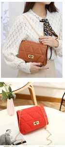 Detail of elegant quilted chain bag with gold metal twist lock for women in cognac brown