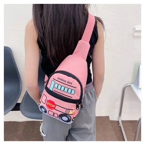Rear view of a child wearing the pink school bus cartoon chest bag in an indoor setting