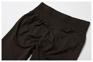 Detail view of high waist scrunch butt yoga leggings in dark coffee brown fabric