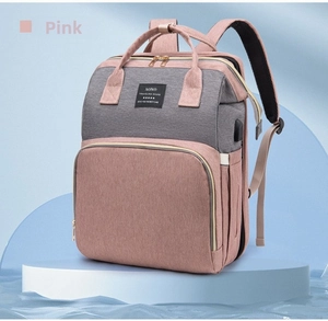 Detail view of the pink and grey diaper bag with reinforced padded shoulder straps