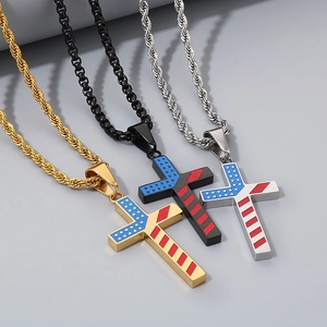 Three stainless steel cross necklaces in gold, black, and silver with US flag design