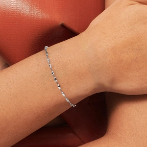 Classic S925 sterling silver water wave link chain bracelet on a model wrist