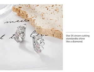 Close-up of S925 sterling silver unicorn hoop earrings with 5A colorful cubic zirconia