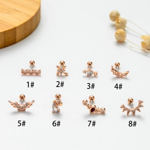 Detailed view of rose gold screw-back stud earrings with zircon wings and heart accents