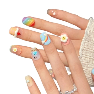 Handmade 3D cartoon press-on nails featuring colorful rainbow, clouds and smiley faces