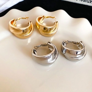 Modern double layer C-shaped hoop earrings in polished gold and silver finishes