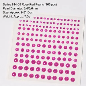 Flat lay of 165 rose red half-round pearl stickers in 3mm to 6mm sizes for nail art